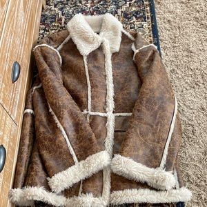 Women’s large Urban outfitters sherpa lined leather coat/ jacket. Never worn.